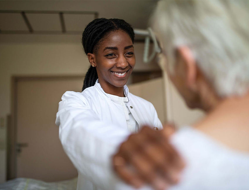 doctor resting hand on patient's shoulder